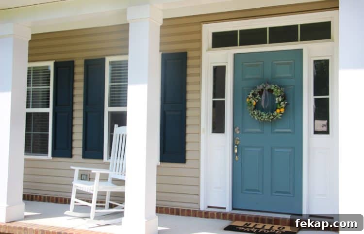 Bright pops of citrus, greenery and gingham combine for an adorable & easy citrus wreath to make this summer! citrus wreath on front door