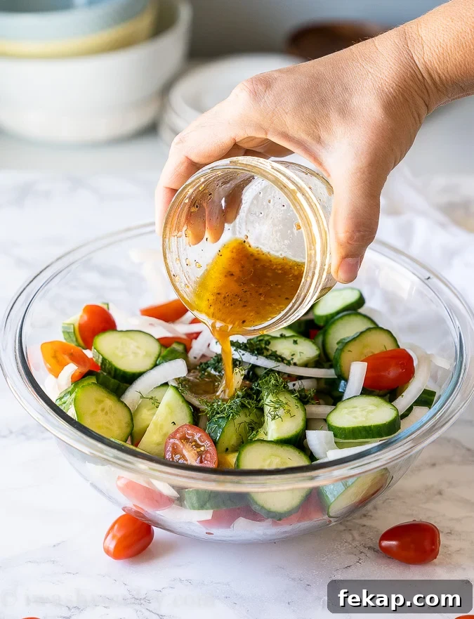 Cucumber Tomato Salad Recipe with Feta and Fresh Herbs 3 Pour simple vinaigrette over the cucumber salad