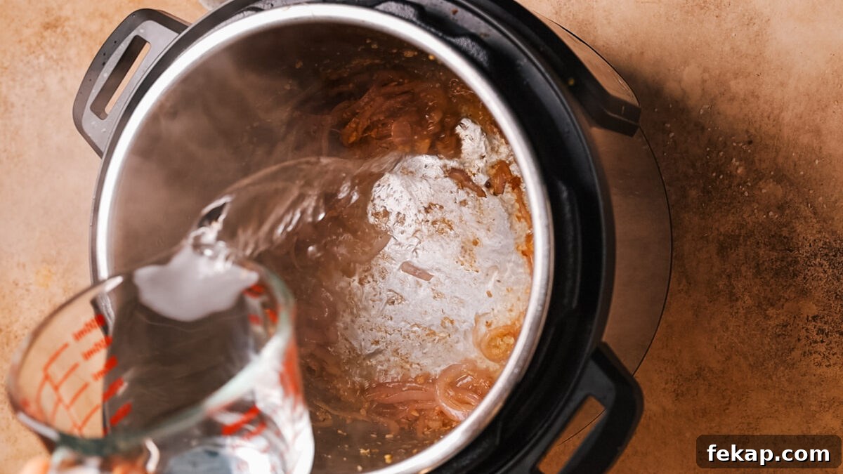 adding beef broth