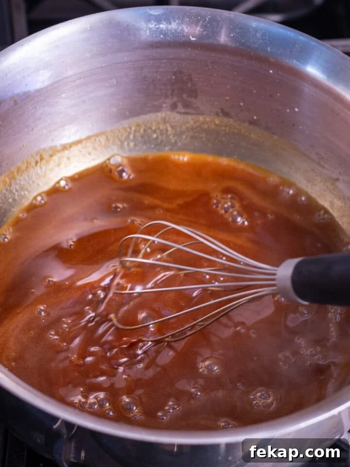 Homemade Salted Caramel Syrup Recipe for Coffee and Desserts 7 whisking the salt and vanilla extract into the salted caramel syrup