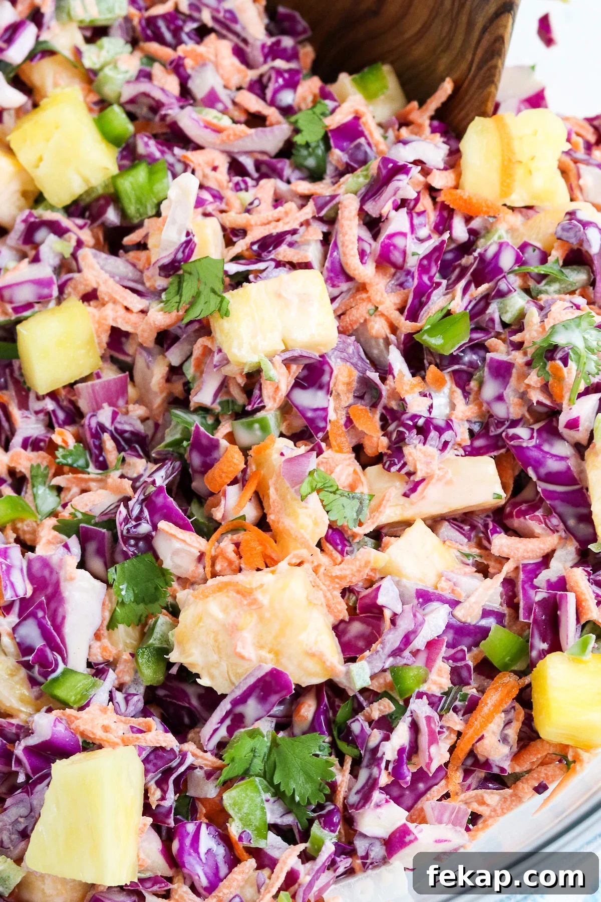 pineapple chunks mixed with chopped red cabbage, carrots, diced jalapenos tossed in a creamy dressing.