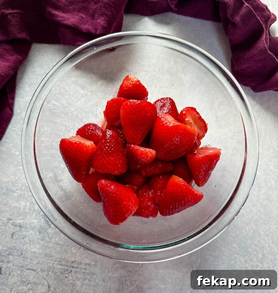 How to Make a Hennessy Margarita Cocktail 4 strawberries in a glass bowl
