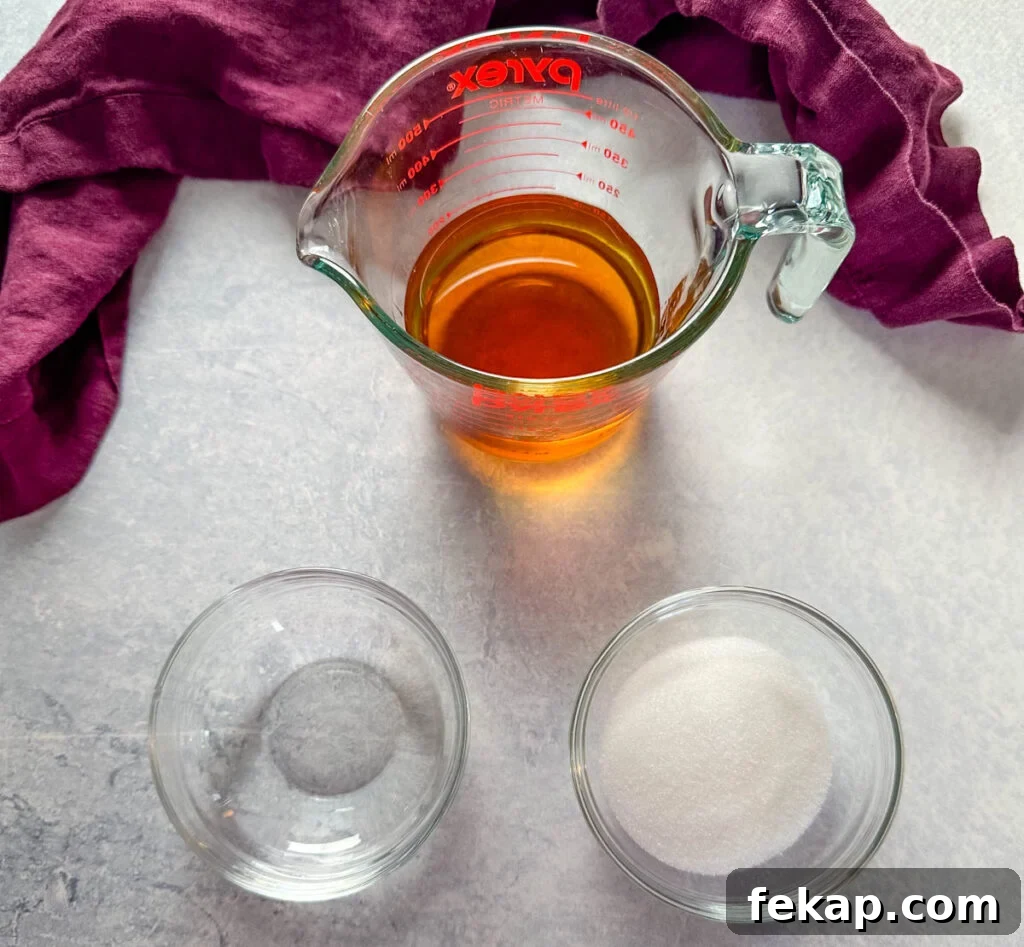 How to Make a Hennessy Margarita Cocktail 5 Hennessy, sugar, and water in separate bowls
