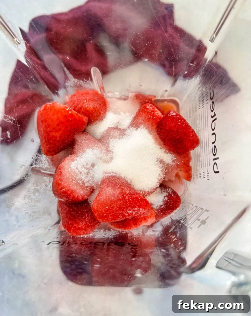 How to Make a Hennessy Margarita Cocktail 6 strawberries, sugar, and water in a blender