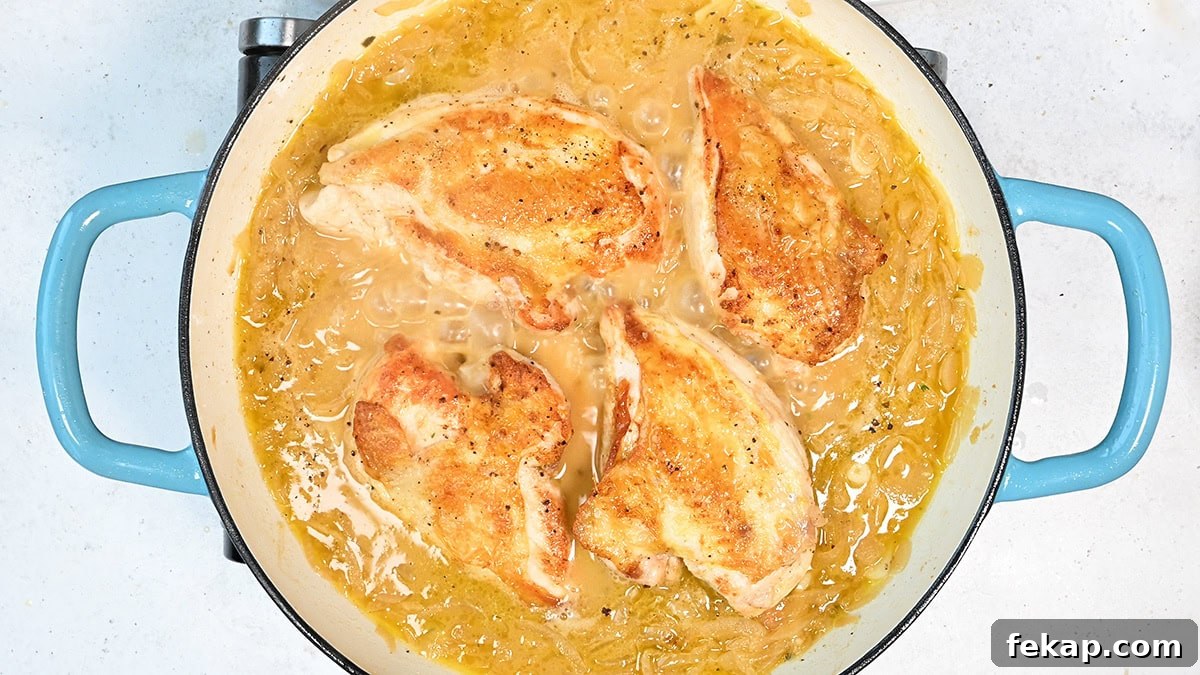 chicken breasts cooking in French onion gravy