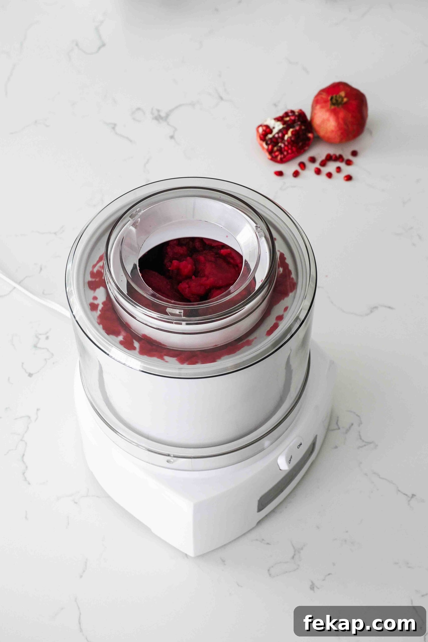 Homemade Pomegranate Sorbet Recipe 11 Frozen pomegranate sorbet in an ice cream maker.