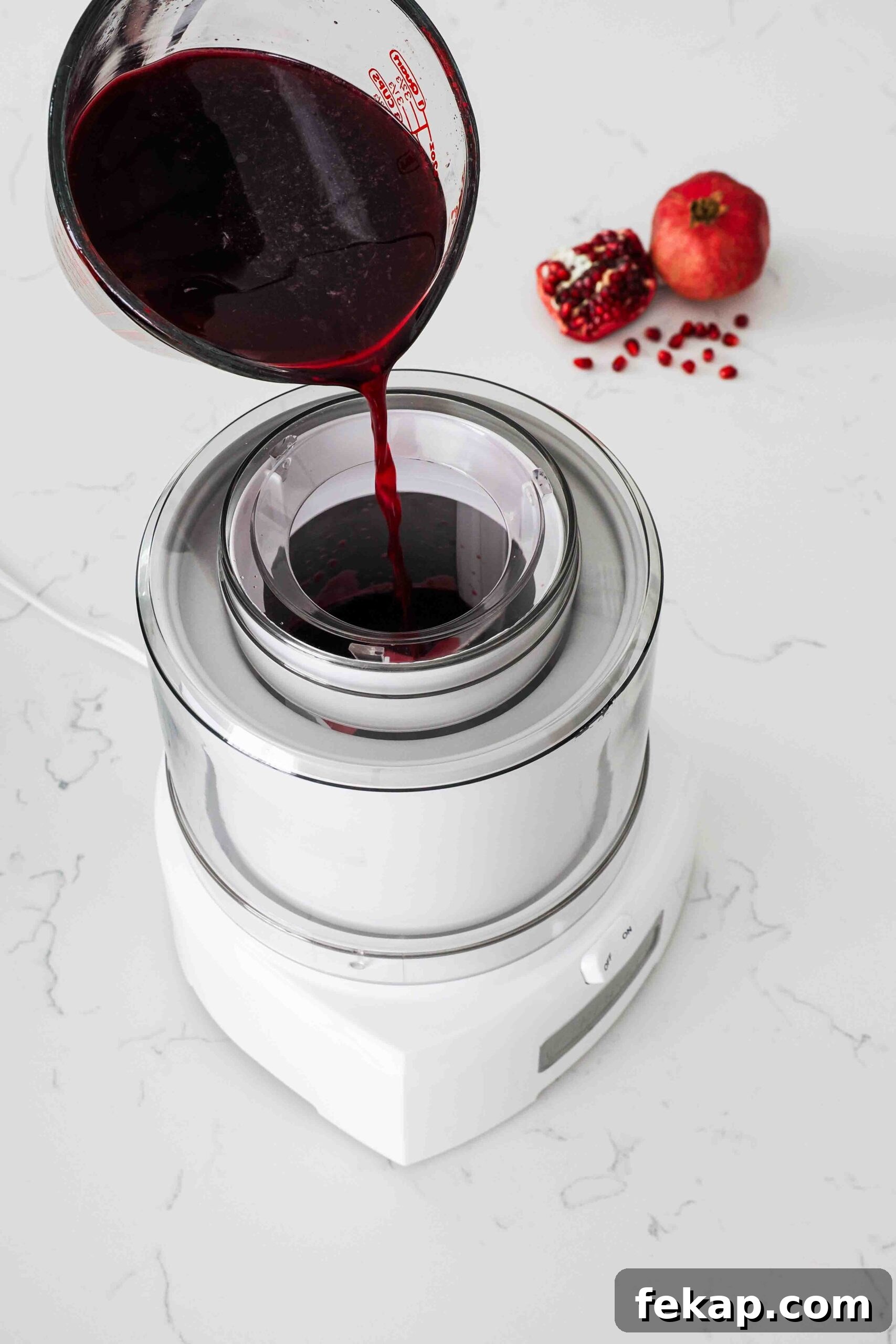 Homemade Pomegranate Sorbet Recipe 8 Pomegranate sorbet mix is poured into an ice cream maker.