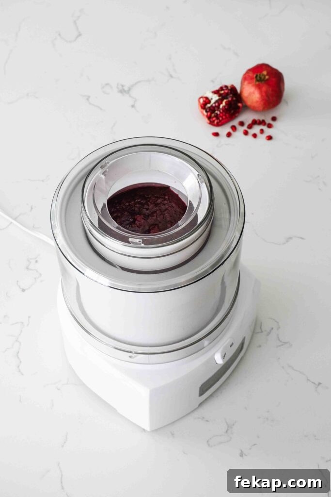 Homemade Pomegranate Sorbet Recipe 9 Partially frozen pomegranate sorbet in an ice cream maker.