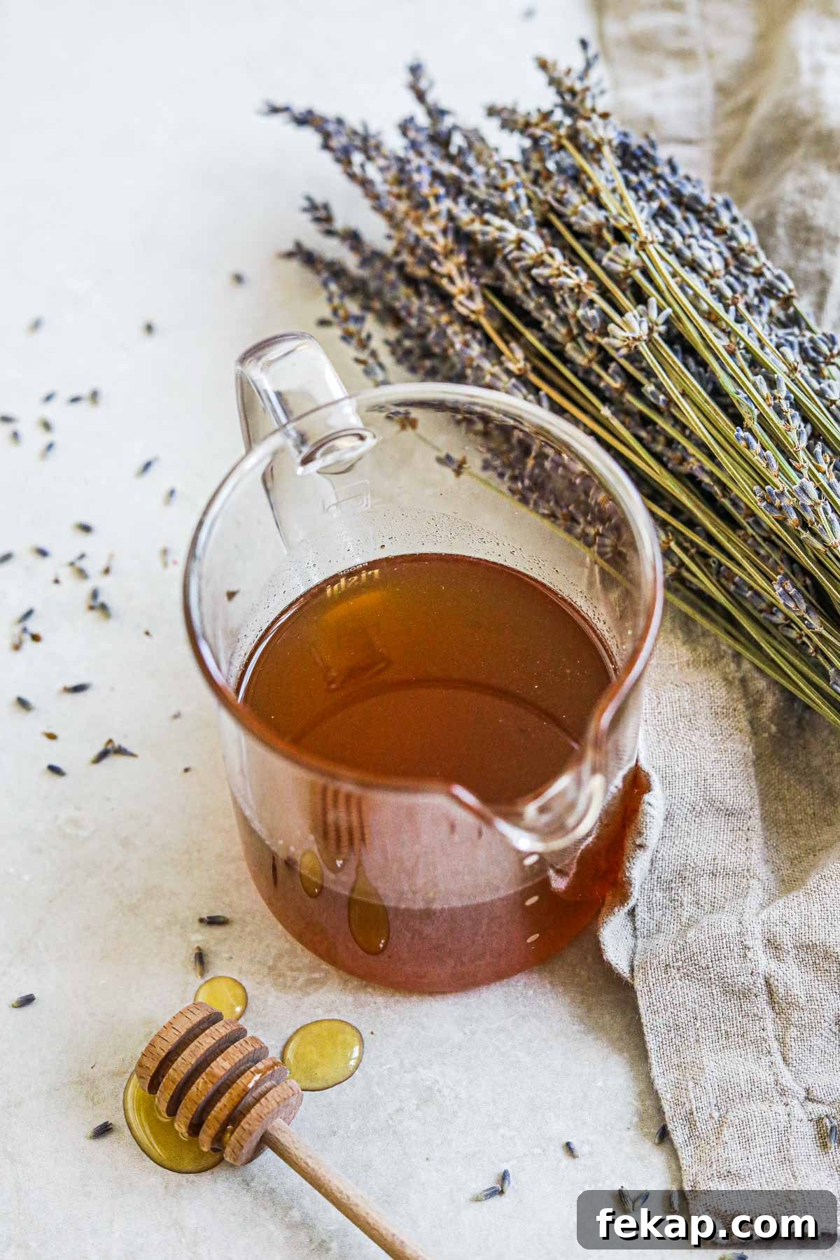 Honey Lavender Simple Syrup Recipe for Cocktails and Desserts 2 Honey lavender simple syrup in a glass carafe for lattes, tea, cocktails, and more.