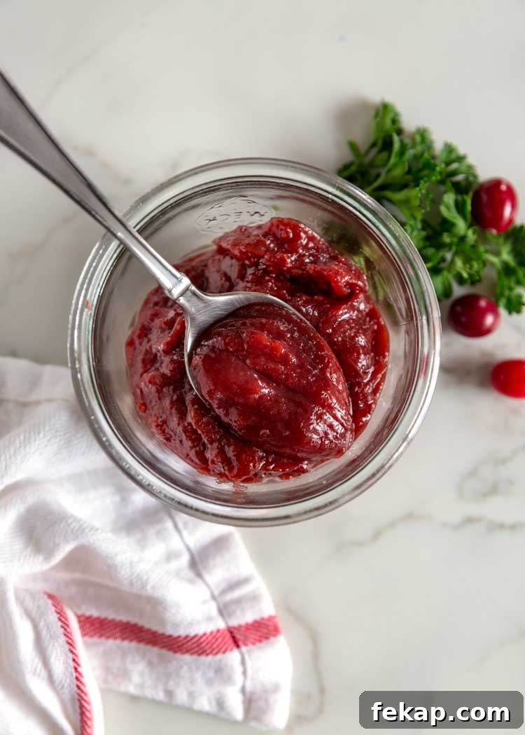 Cranberry butter made in a Crock Pot Express using cranberries, orange zest, cinnamon, brown sugar & chile for a perfect balance of sweet, tangy and spicy. Sweet and Spicy Cranberry Butter