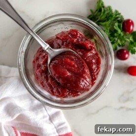 A jar and spoon in Cranberry butter