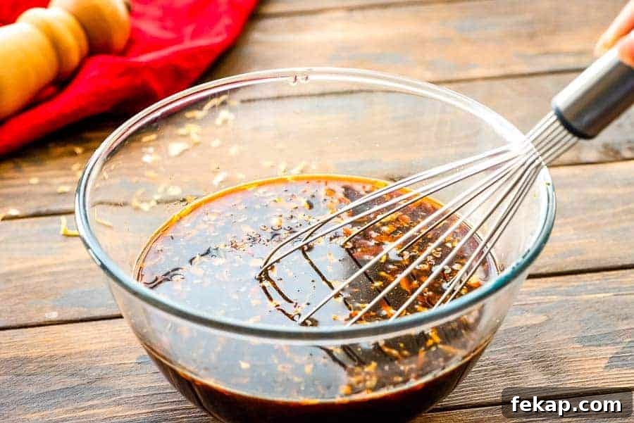 Teriyaki Marinade Recipe for Chicken, Beef & Fish 3 Marinade in bowl with whisk