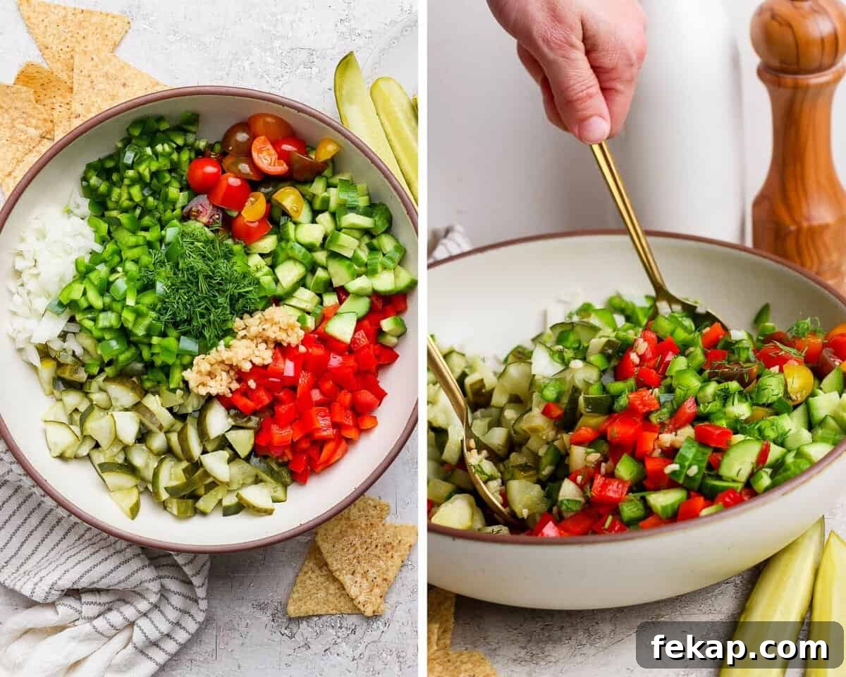 All ingredients in a serving bowl.  Two hands holding spoons to toss the salad.