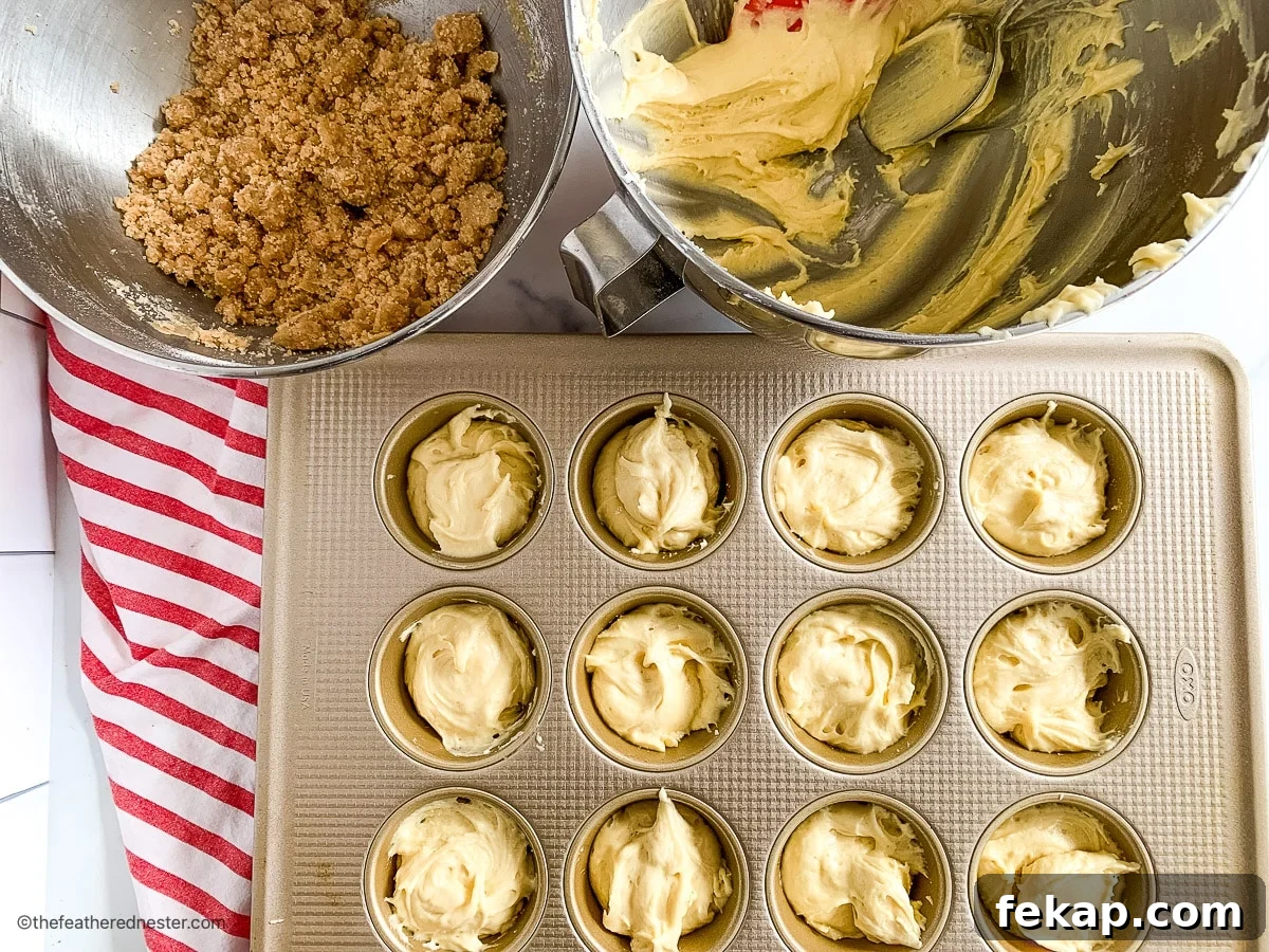 Coffee Cake Muffins with Cinnamon Streusel 7 Batter for cinnamon streusel muffins in a baking pan.