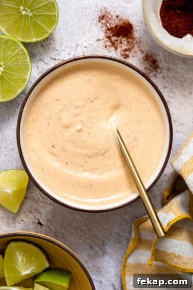 Chipotle Mayo in a bowl with a spoon.