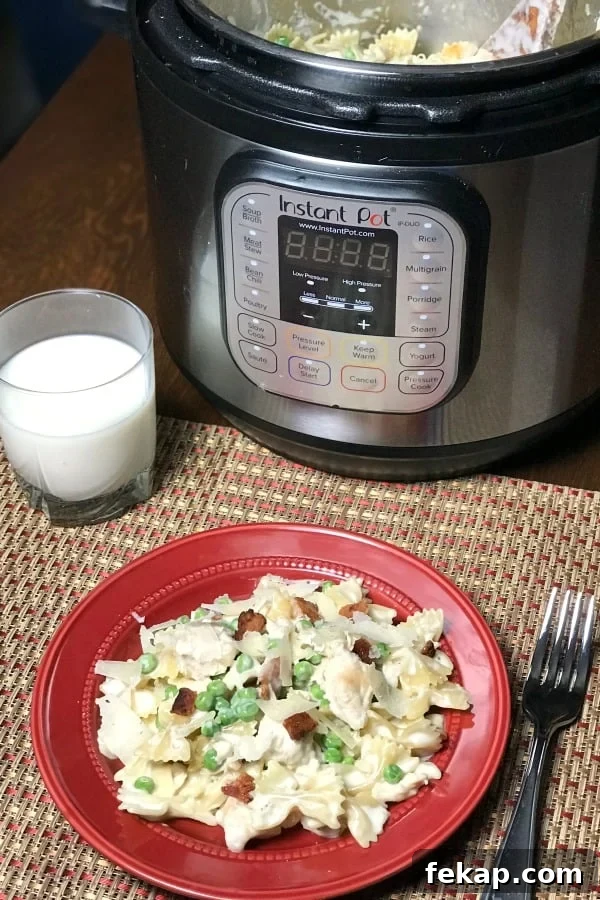 Creamy Instant Pot Chicken and Bacon Carbonara 3 Instant Pot chicken carbonara on bowtie pasta with peas, bacon and cream sauce