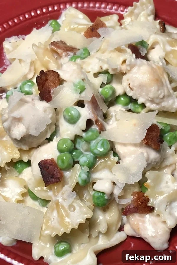 Creamy Instant Pot Chicken and Bacon Carbonara 4 Copycat chicken carbonara plated with pasta, bacon and peas