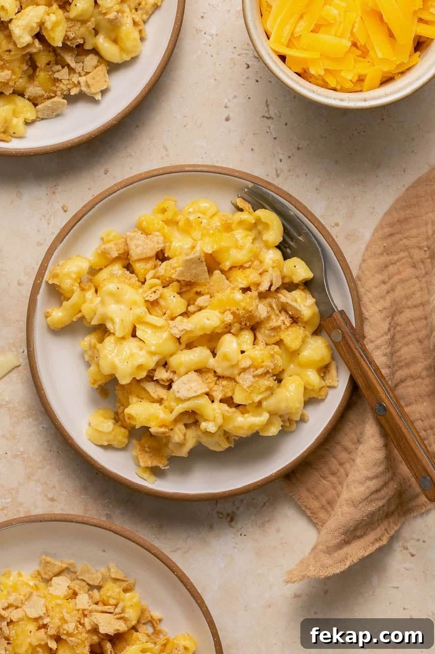 Creamy Oven-Baked Gluten-Free Mac and Cheese Recipe 8 plates of baked gluten free mac and cheese with a brown napkin