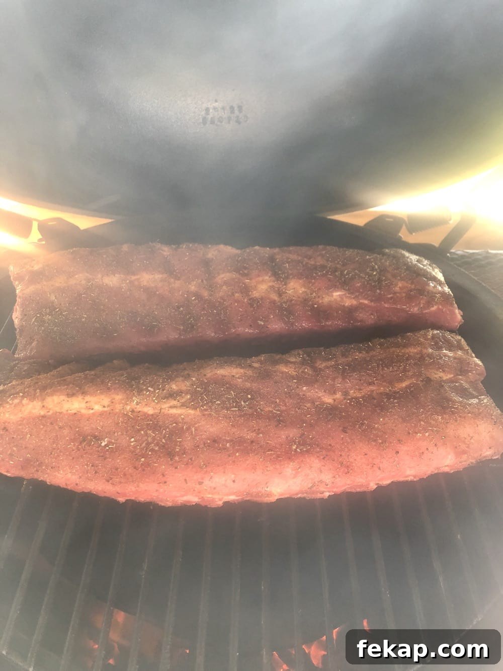 Hickory smoked baby back ribs on the grill 2 racks ribs on a big green egg grill