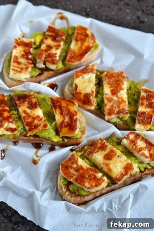 Grilled Halloumi, Avocado and Pomegranate Molasses Tartine served on a crinkled piece of parchment paper - Tartine recipe