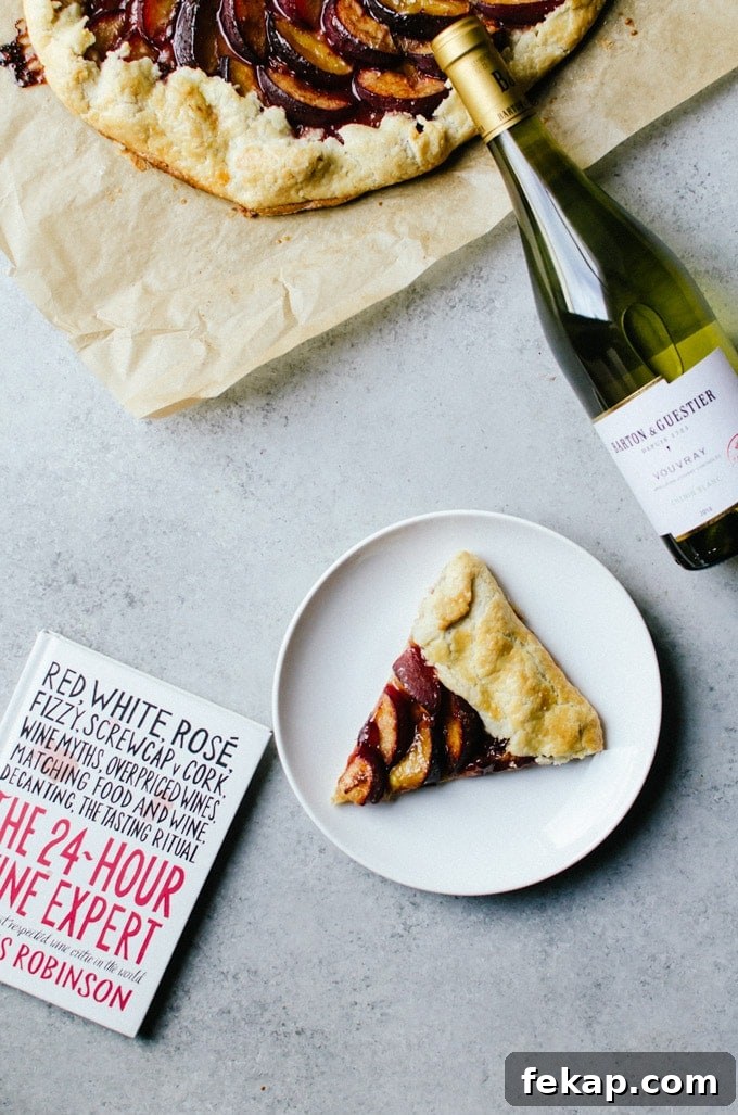 Plum Galette Recipe with Flaky Cinnamon Butter Crust 5 slice on white plate