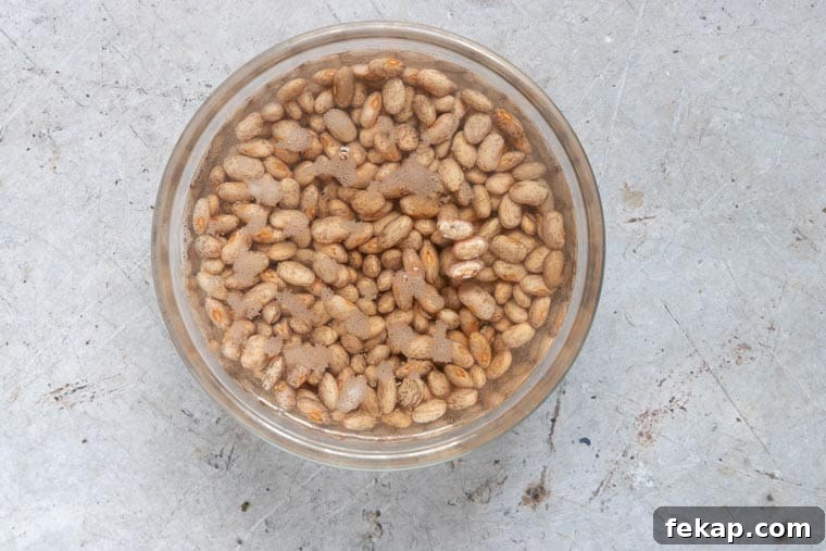 pinto beans soaking in water