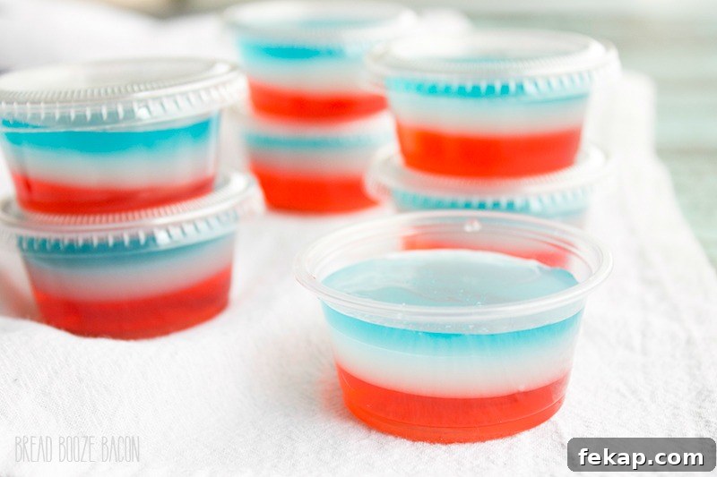 Red White and Blue Bomb Pop Jello Shot Recipe 3 Turn one of your favorite popsicles into Bomb Pop Jello Shots! They're perfect for Memorial Day or 4th of July parties!