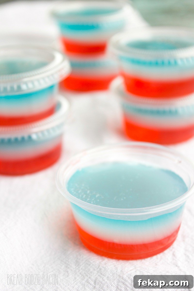 Red White and Blue Bomb Pop Jello Shot Recipe 4 Turn one of your favorite popsicles into Bomb Pop Jello Shots! They're perfect for Memorial Day or 4th of July parties!