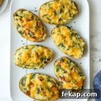 spinach and cheddar twice-baked potatoes on a large white platter