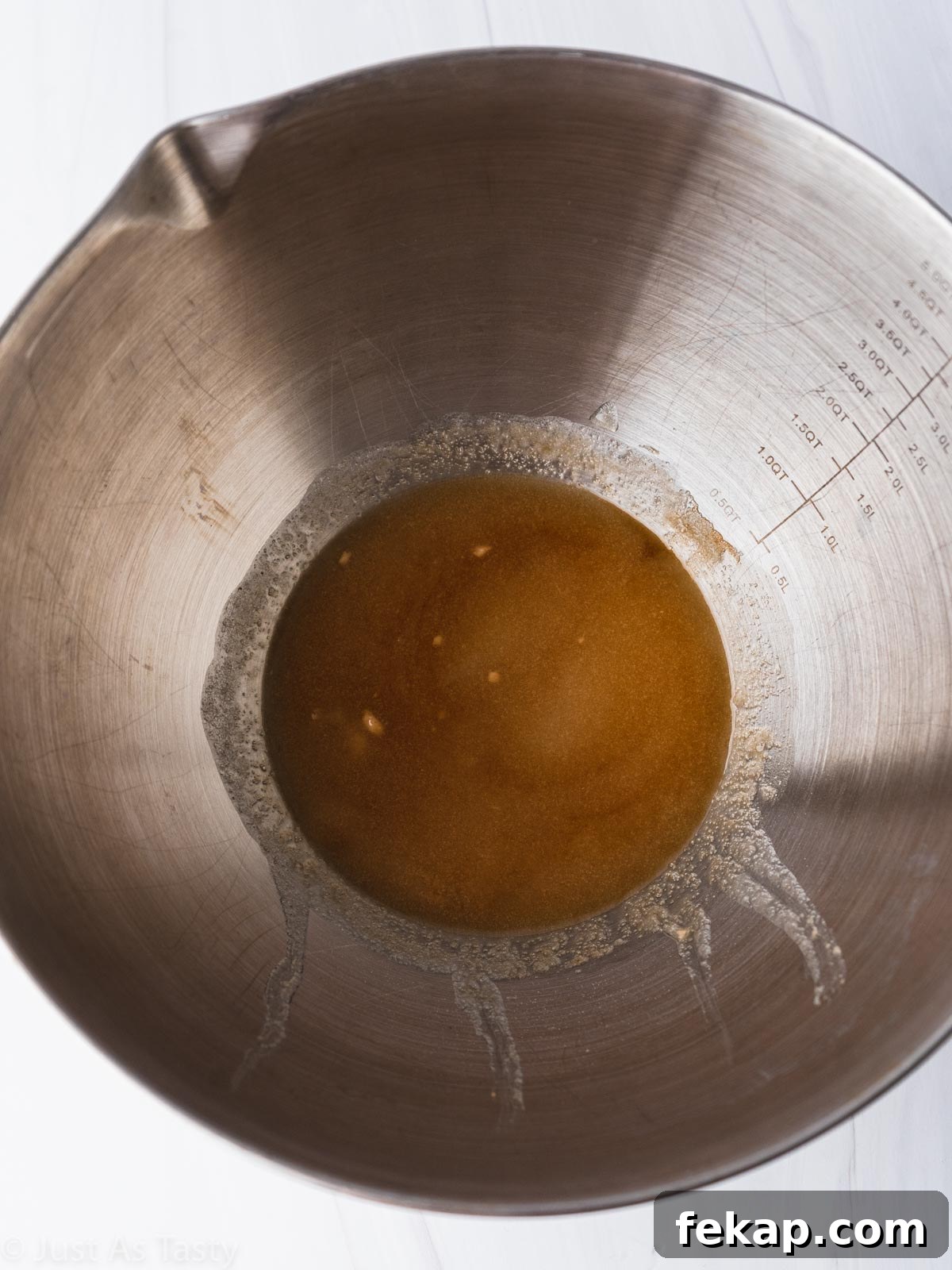 Gluten-Free Chocolate-Dipped Madeleines 5 Wet ingredients in a bowl.