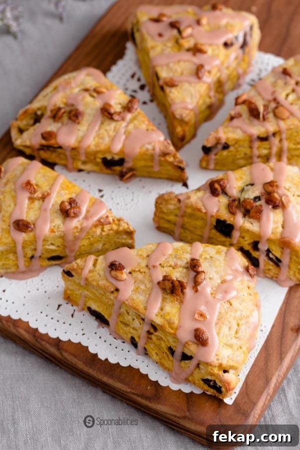 Quick Breads: Types, Uses, and Baking Guide 10 a wooden platter with white doily with six cherry pumpkin scones on top.