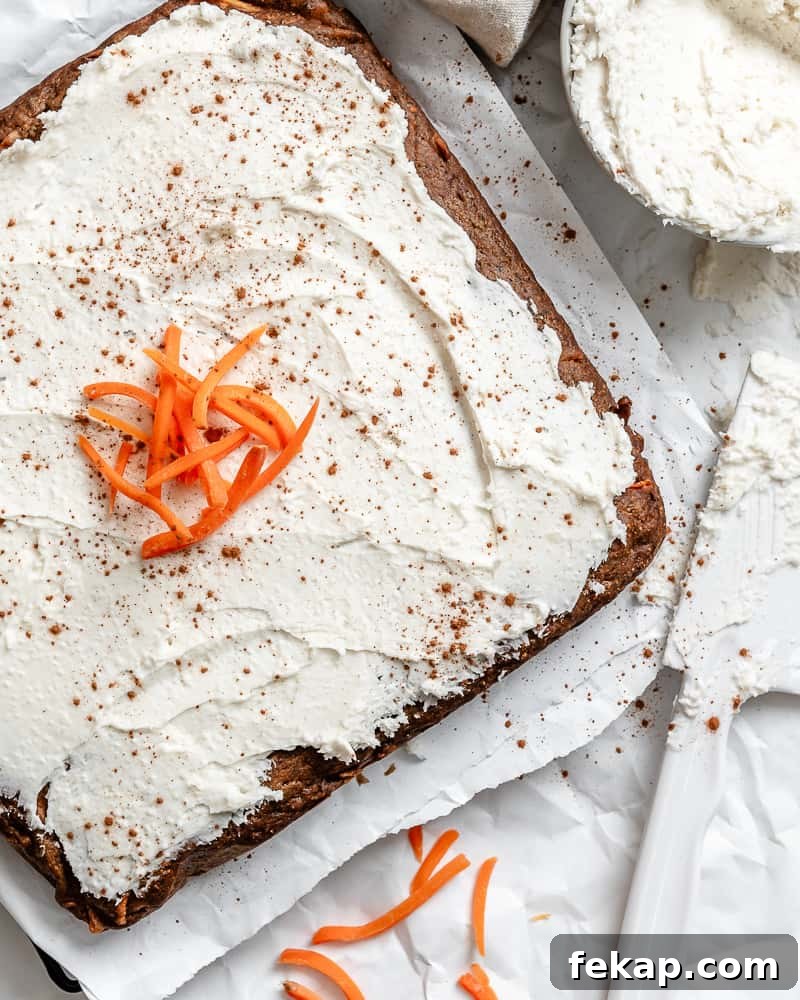 Moist Vegan Carrot Cake Recipe with Creamy Frosting 2 completed Vegan Carrot Cake on a white surface