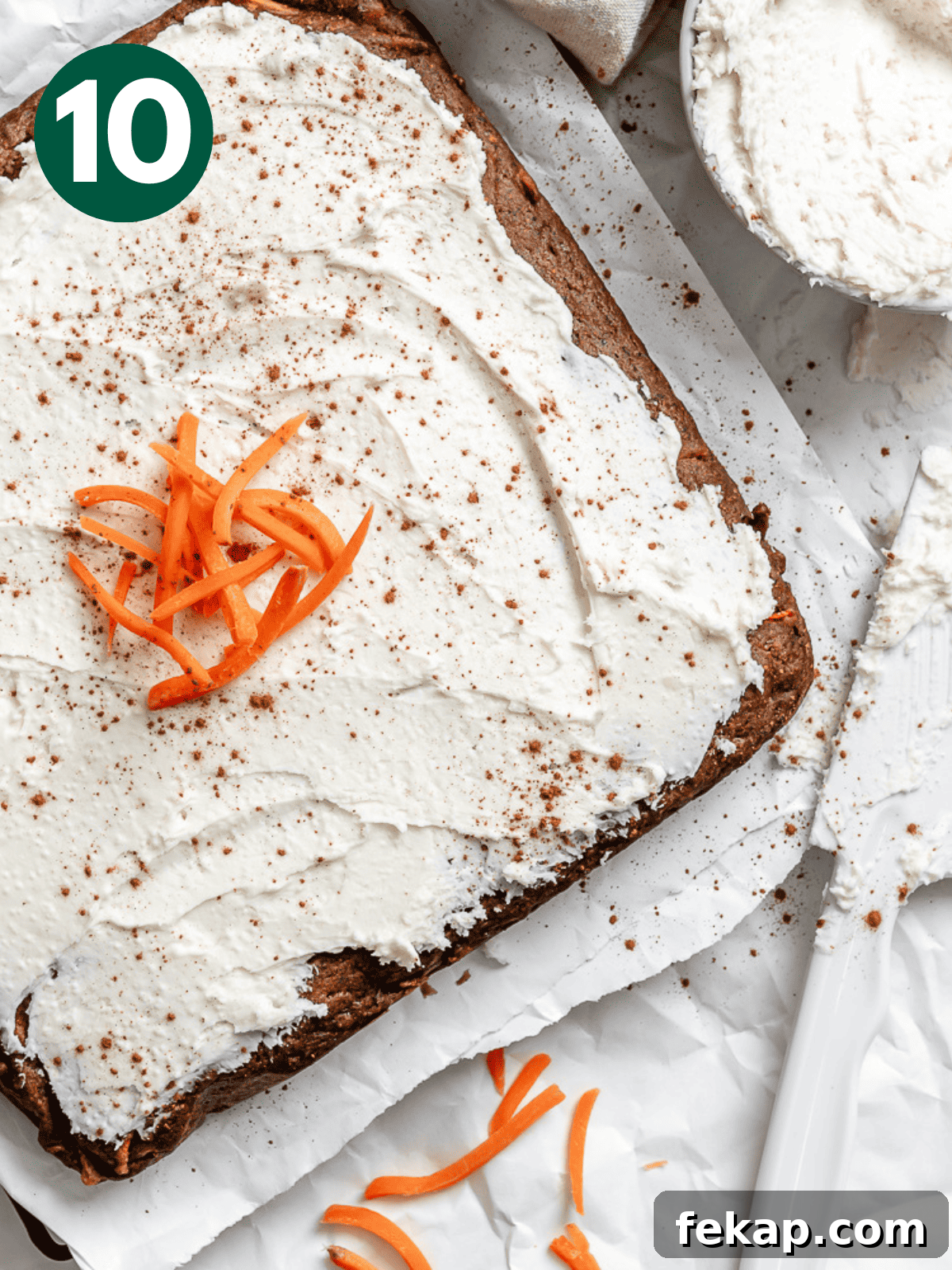 Moist Vegan Carrot Cake Recipe with Creamy Frosting 4 completed Vegan Carrot Cake on a white surface