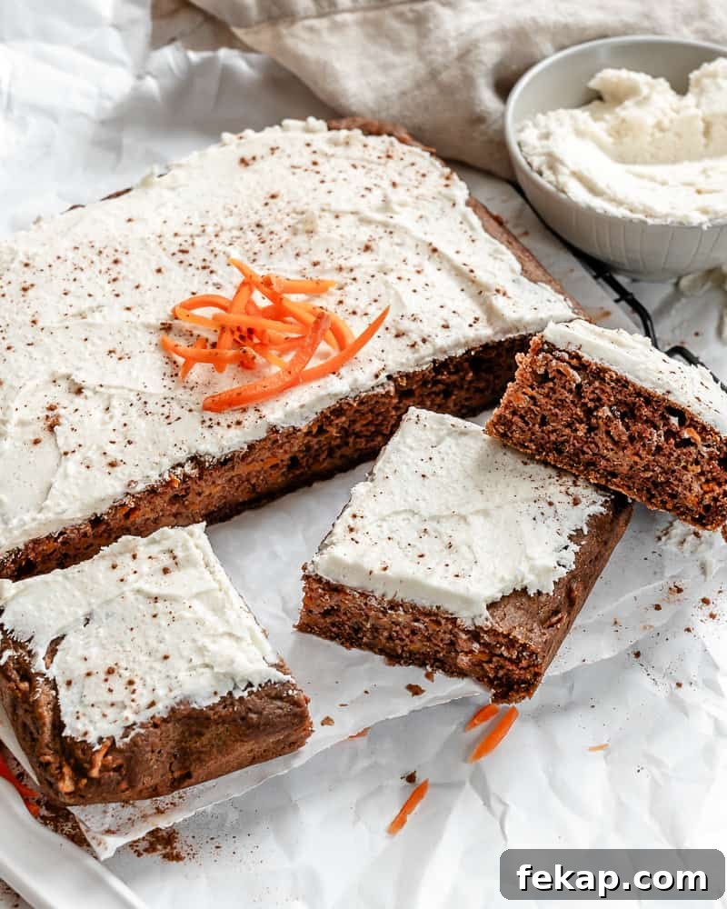 Moist Vegan Carrot Cake Recipe with Creamy Frosting 5 completed Vegan Carrot Cake on a white surface