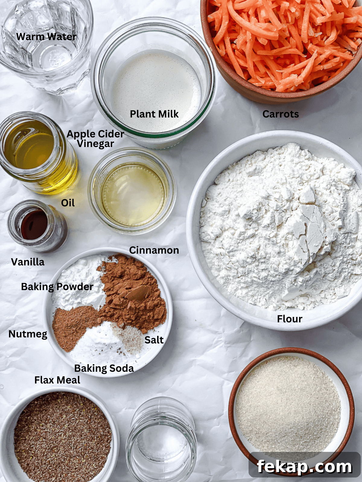 Moist Vegan Carrot Cake Recipe with Creamy Frosting 3 ingredients for Vegan Carrot Cake on a white surface
