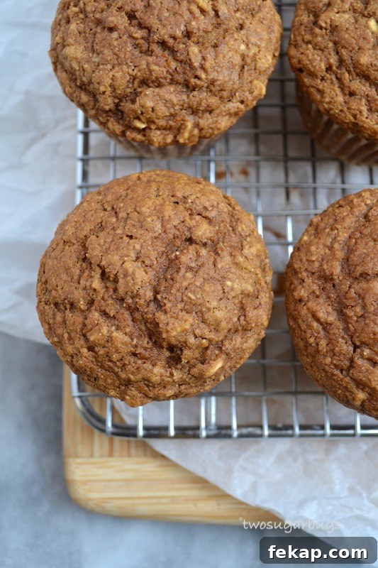 A healthier gingerbread muffin with a cream cheese cinnamon drizzle, packed with oats and bran to help keep you full and running through your busy morning. #twosugarbugs #gingerbread #healtiermuffins #breakfastisserved