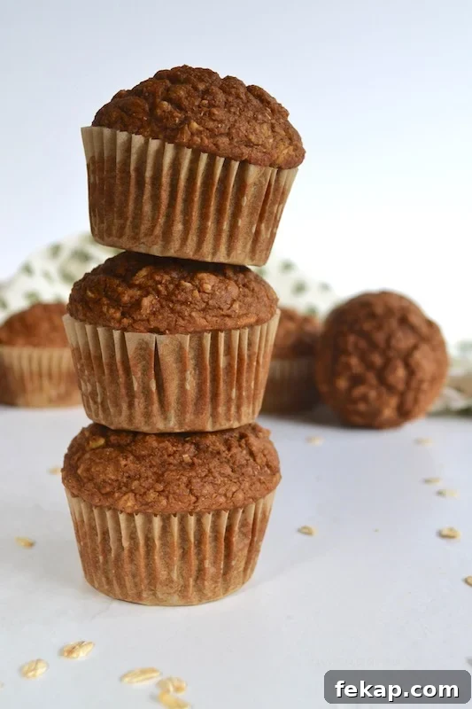 A healthier gingerbread muffin with a cream cheese cinnamon drizzle, packed with oats and bran to help keep you full and running through your busy morning. #twosugarbugs #gingerbread #healtiermuffins #breakfastisserved
