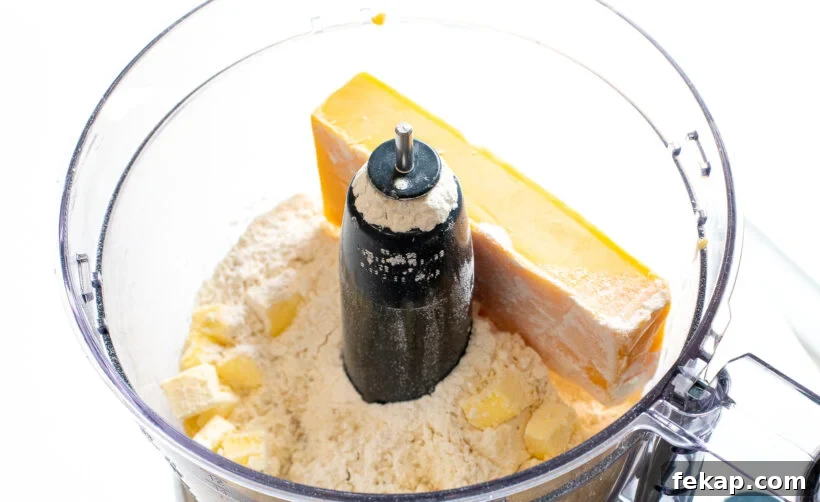 Homemade Goldfish Crackers Recipe: Baked Cheddar Snacks 3 Ingredients for goldfish crackers in a food processor.