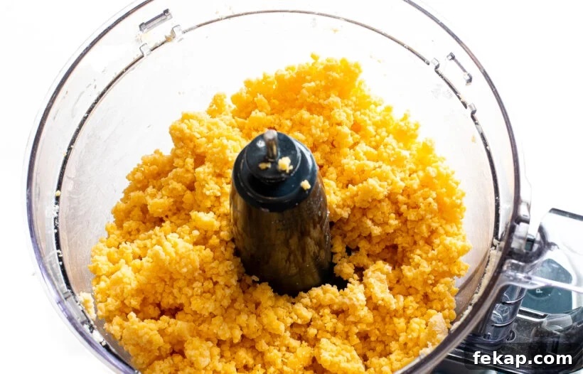 Homemade Goldfish Crackers Recipe: Baked Cheddar Snacks 4 Goldfish cracker dough in a food processor.