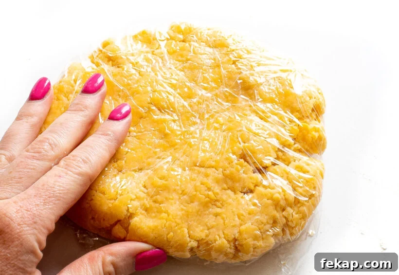 Homemade Goldfish Crackers Recipe: Baked Cheddar Snacks 5 Goldfish dough wrapped in plastic wrap.