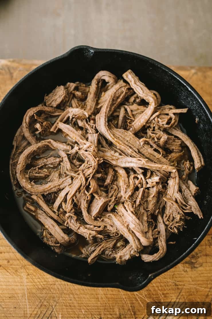 Machaca con Huevo: Shredded Beef and Eggs Recipe 4 Shredded beef brisket in a skillet used to make machaca con huevo recipe for authentic Northern Mexican breakfast by Yvette Marquez-Sharpnack of Muy Bueno.