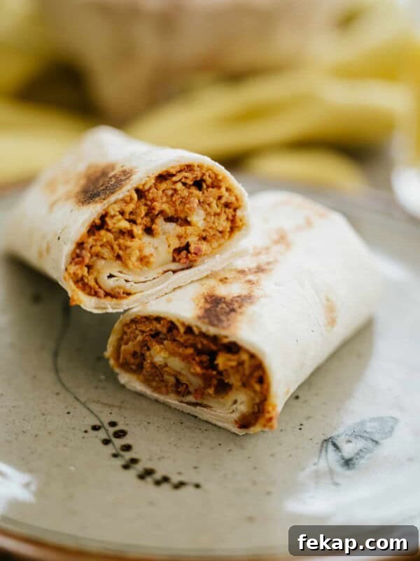 egg and chorizo breakfast burrito split in half