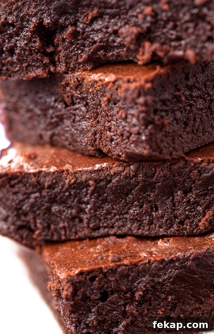 The Fudgiest Brownies Recipe 2 Fudgy brownies on a plate