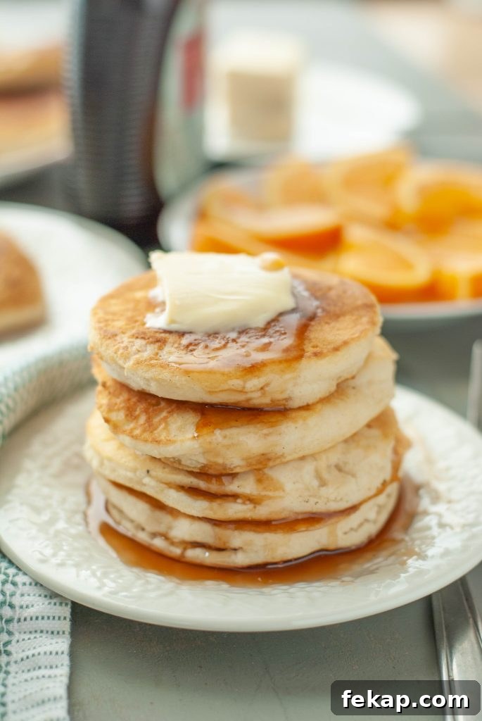 28 Gluten-Free Dairy-Free Brunch Recipes with Vegan Options 15 gluten-free-vegan-pancake-stack-with-butter-and-syrup-running-down