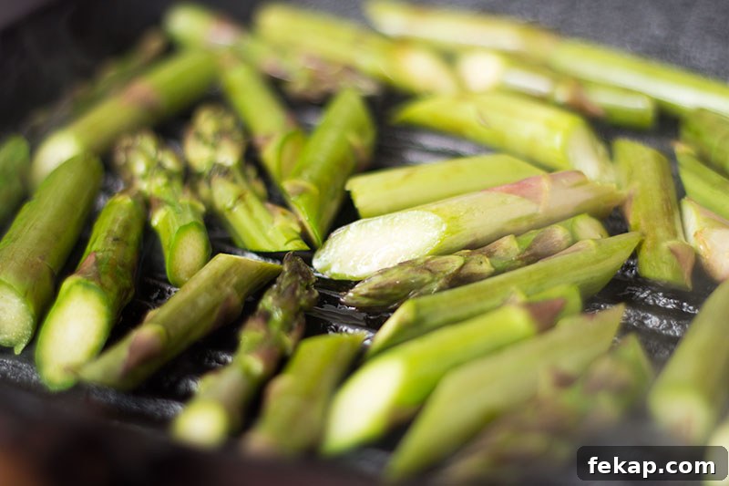 Roasted Asparagus with Preserved Lemon Recipe 2 Asparagus cooking on a griddle