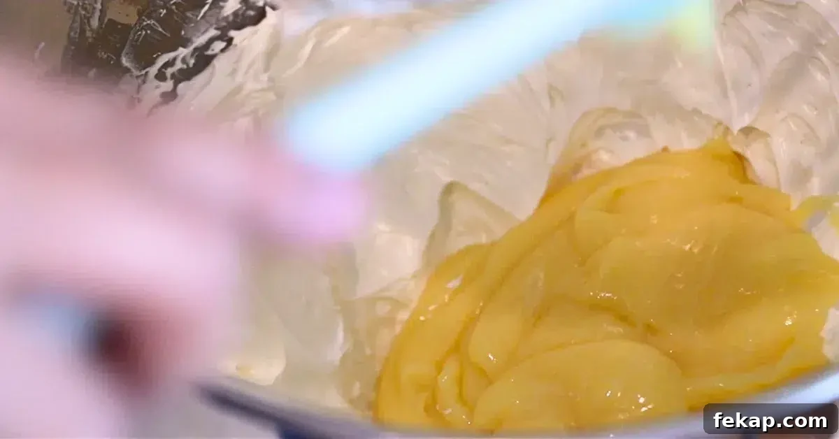 adding lemon curd to Swiss buttercream