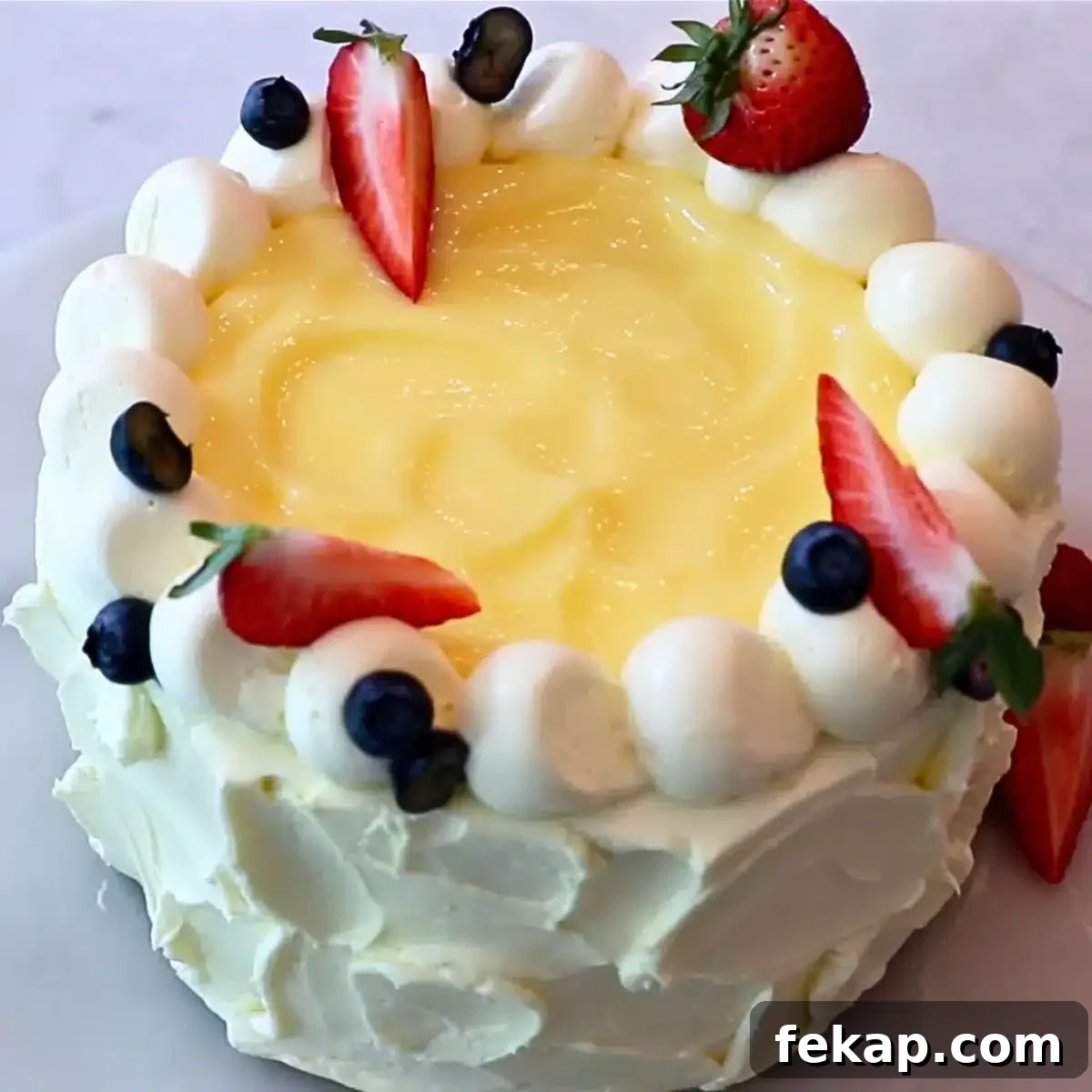 a whole lemon cake with lemon curd