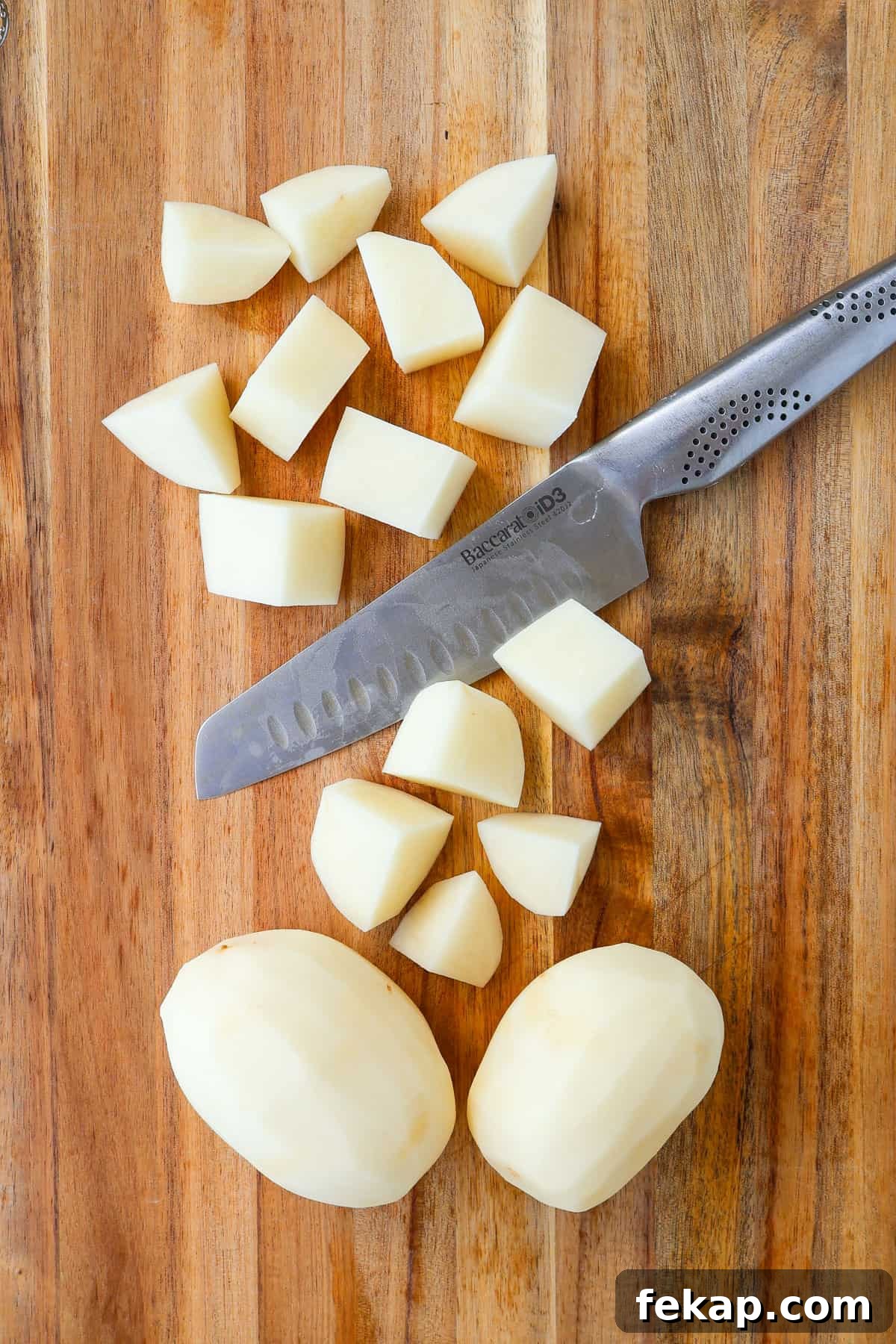 Creamy Cottage Cheese Mashed Potatoes Recipe 4 Chopped potatoes on a wooden board.