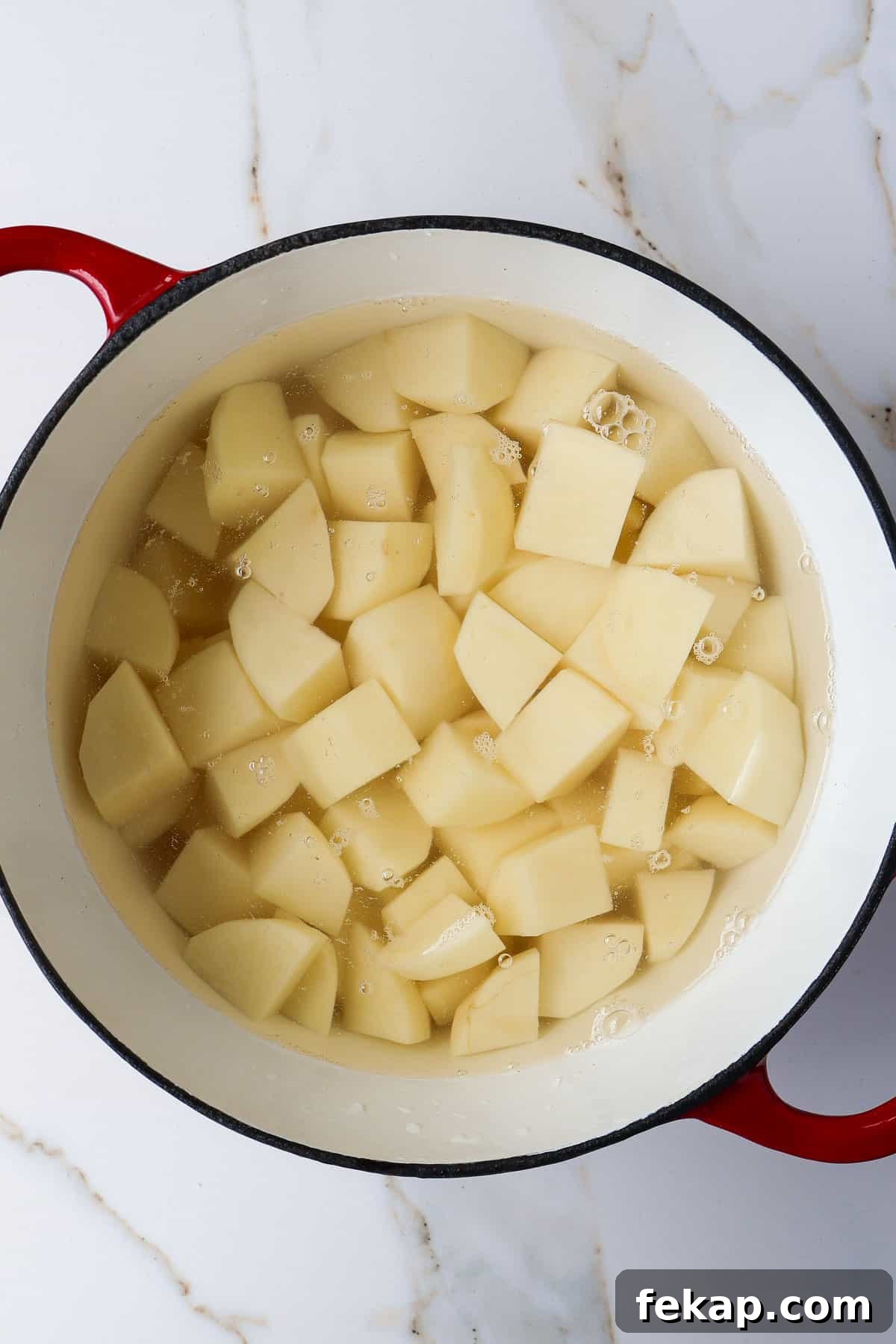 Creamy Cottage Cheese Mashed Potatoes Recipe 5 Potatoes in a pot of water.
