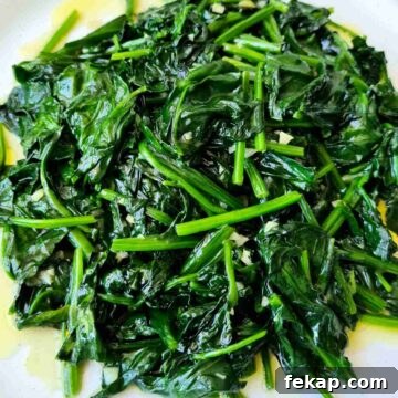 Garlic Stir-Fried Spinach Recipe 13 Close up of a plate of glossy stir fried english spinach with garlic